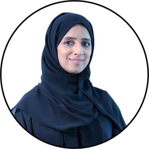 Smiling woman in black hijab portrait.
